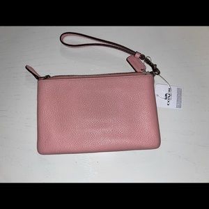 Pink Coach wristlet, new with tags.